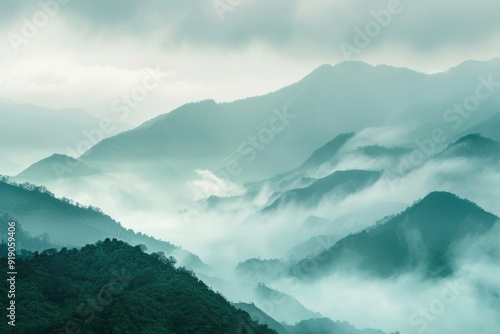 A scenic view of a mountain range shrouded in fog, great for use as a background or atmospheric image