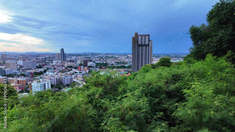Overview of the coastal Pattaya city with buildings and green hills at early Morning. Overview of the coastal Pattaya city with buildings and green hills at early Morning.