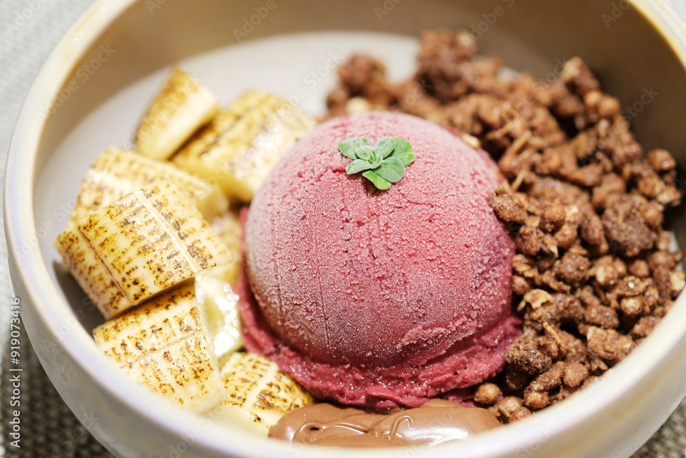 Home made Acai berry yogurt with banana, granola and dark chocolate, Healthy dessert bowl, tasty superfood Home made Acai berry yogurt with banana, granola and dark chocolate, Healthy dessert bowl, tasty superfood