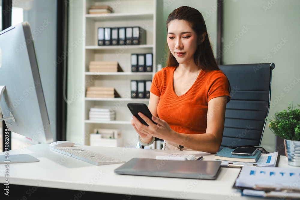 Business woman or financial data analysts working with smartphone and laptop computers and data graphs together. Plan to analyzing projects in the office. Business woman or financial data analysts working with smartphone and laptop computers and data graphs together. Plan to analyzing projects in the office.