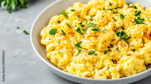 Cheesy scrambled eggs with herbs and spices