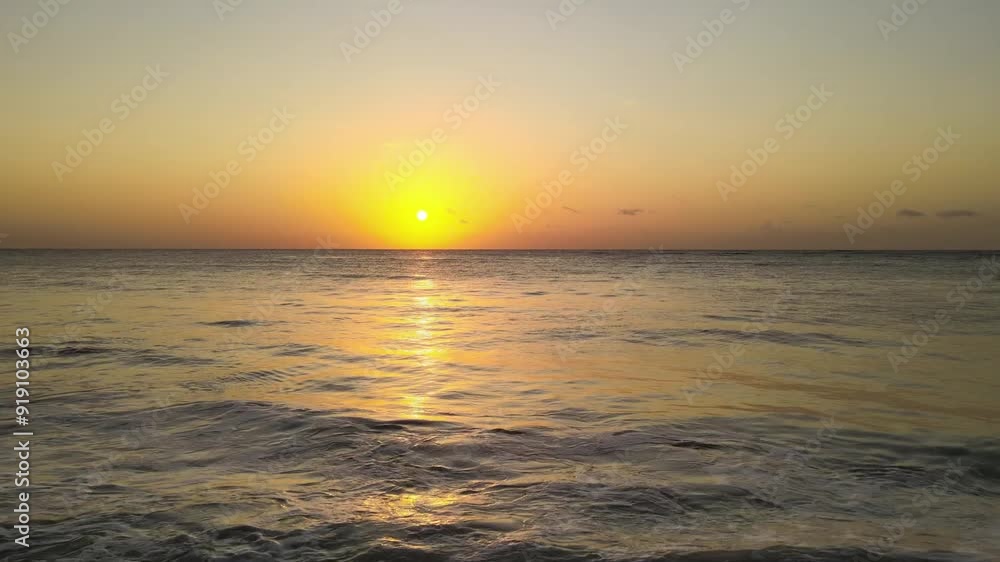 Slow aerial shot overhead waves crashing on the shore at Lake Victoria at sunset Slow aerial shot overhead waves crashing on the shore at Lake Victoria at sunset
