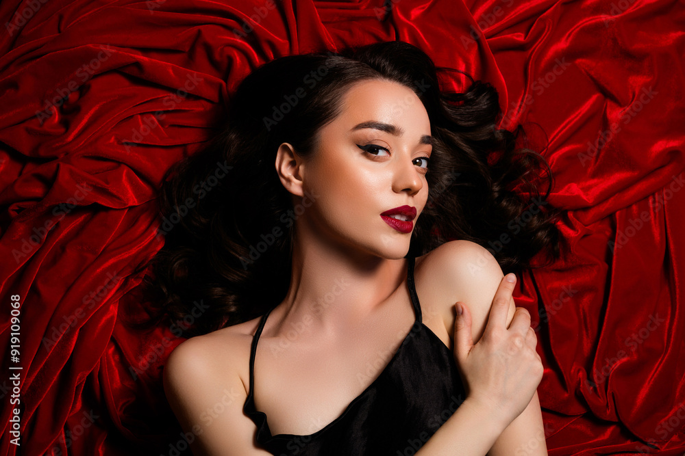 Top photo of chic girl feel tempting passionate teasing touch shoulder arm over red velvet textile background Top photo of chic girl feel tempting passionate teasing touch shoulder arm over red velvet textile background