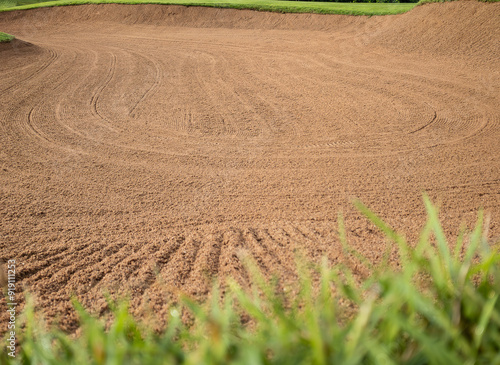 Golf Course Sand Pit Bunkers, green grass surrounding the beautiful sand holes is one of the most challenging obstacles for golfers and adds to the beauty of the golf course.