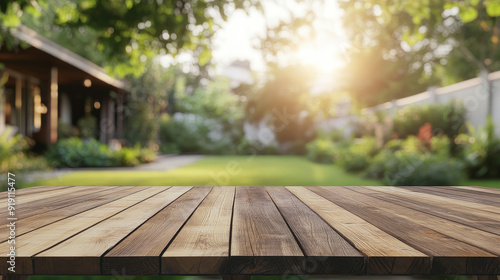 "Empty wooden table with a blurred green home backyard view in the background, ideal for advertising and promotional templates."