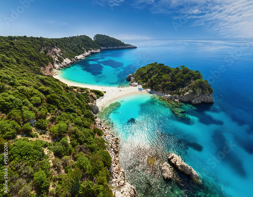 Aerial view of turquoise lagoon of sea with white sandy coast surrounded with green lush trees in tropical island