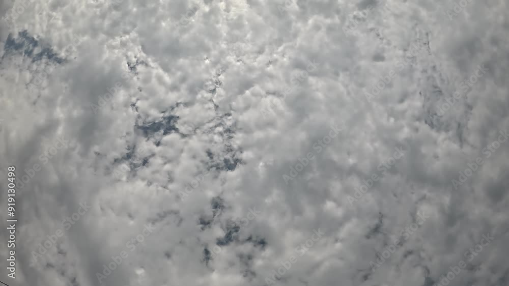 Timelapse fluffy Cumulus clouds moving in bright sunset sky. Abstract aerial nature summer ocean sunset, sea and sky view. Vacation, travel, holiday concept. Weather and Climate Change
