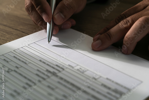 businessman signs form agreement writing on paper Signing contract