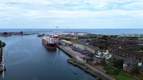 Aerial drone shot of Port of Sunderland with large cargo ship docked in River Wear. Sunderland, UK photo