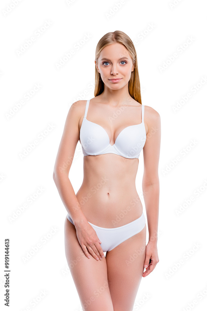 Vertical portrait of nice attractive lovely sweet calm sportive perfect thin skinny blonde girl smooth clean clear healthy skin touching hip isolated over light gray background Vertical portrait of nice attractive lovely sweet calm sportive perfect thin skinny blonde girl smooth clean clear healthy skin touching hip isolated over light gray background