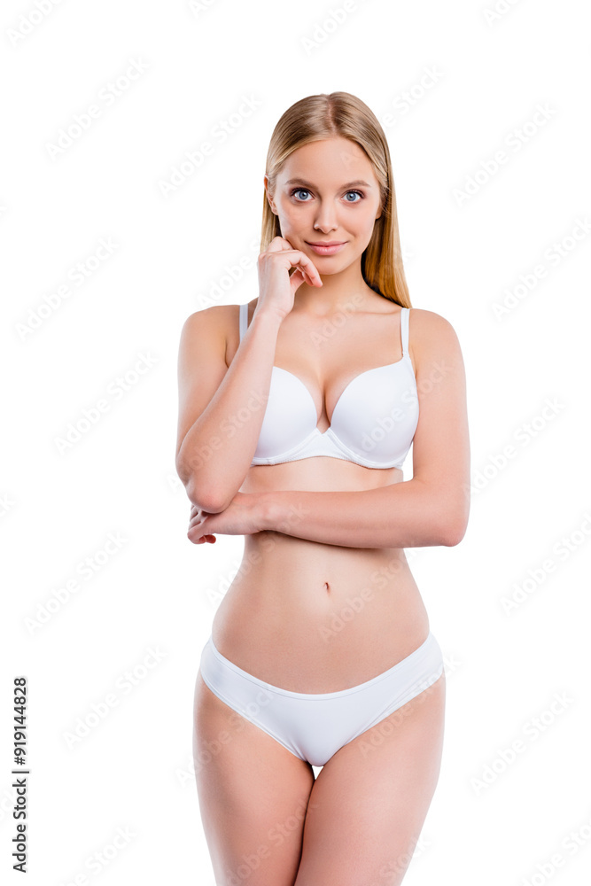 Fototapeta premium Vertical portrait of nice cute attractive lovely sweet delicate winsome sportive perfect skinny blonde girl smooth clean clear healthy skin touching chin isolated over light gray background