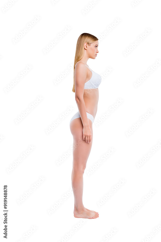 Vertical full length body size profile side view of nice attractive adorable lovely skinny thin sportive candid perfect healthy girl standing straight isolated over light gray background Vertical full length body size profile side view of nice attractive adorable lovely skinny thin sportive candid perfect healthy girl standing straight isolated over light gray background