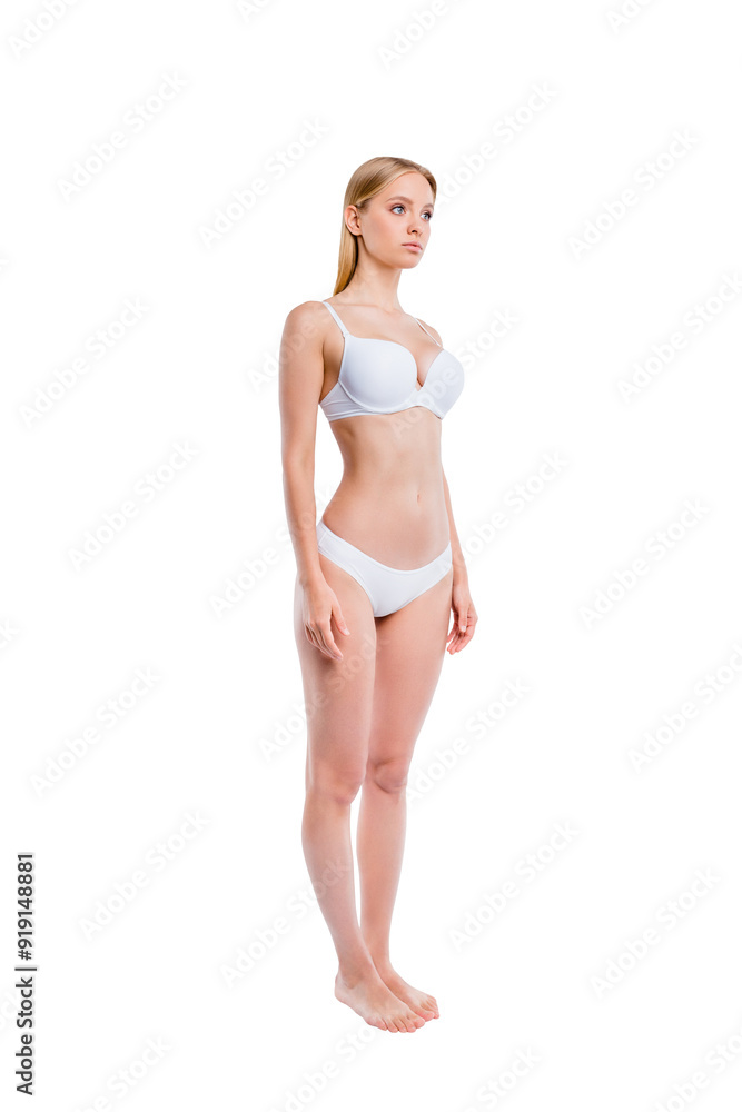 Vertical full length body size profile side half-turned view of nice attractive adorable lovely skinny thin sportive candid perfect healthy girl standing straight isolated over light gray background Vertical full length body size profile side half-turned view of nice attractive adorable lovely skinny thin sportive candid perfect healthy girl standing straight isolated over light gray background