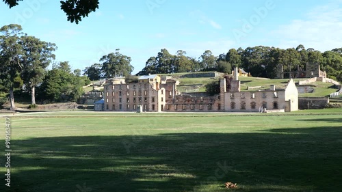 Remains of the main buildings for convicts of a famous Tasmanian prison. Historic buildings and museums in Tasmania. Port Arthur Heritage Prison Site. Park and ancient buildings on a sunny day. 