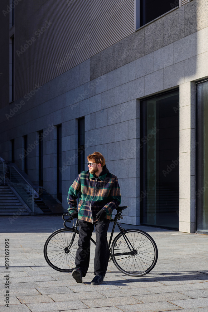 Eco-friendly transport concept. Man moves around the city using a bicycle Eco-friendly transport concept. Man moves around the city using a bicycle
