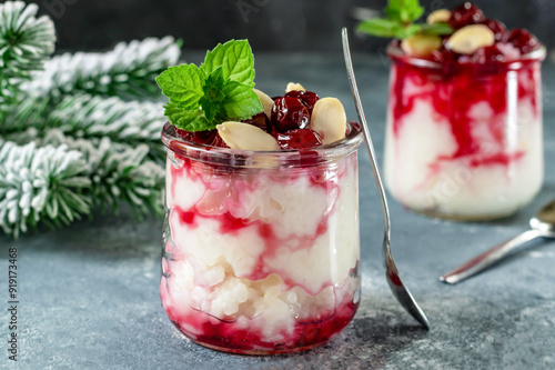 Risalamande is a traditional Danish Christmas dessert, cold rice pudding with whipped cream and almonds. Served with hot cherry sauce.