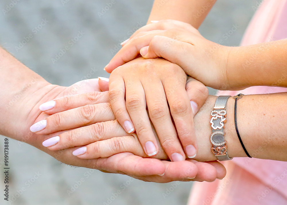 People's hands together, close-up. Team building concept People's hands together, close-up. Team building concept