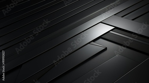 Abstract black geometric pattern with textured surface.