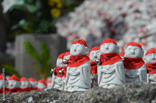 Hundreds of tiny jizo buddhist statues photo