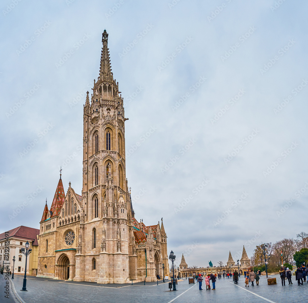 Matthias Church with its tall bell tower, the symbol of Fisherman's Bastion, Budapest, Hungary Matthias Church with its tall bell tower, the symbol of Fisherman's Bastion, Budapest, Hungary