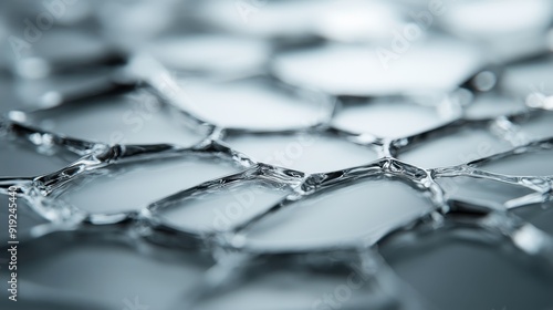 A macro photograph showcasing the intricate geometric shapes and reflective qualities of clear ice against a blurred background, emphasizing its elegance and purity. photo