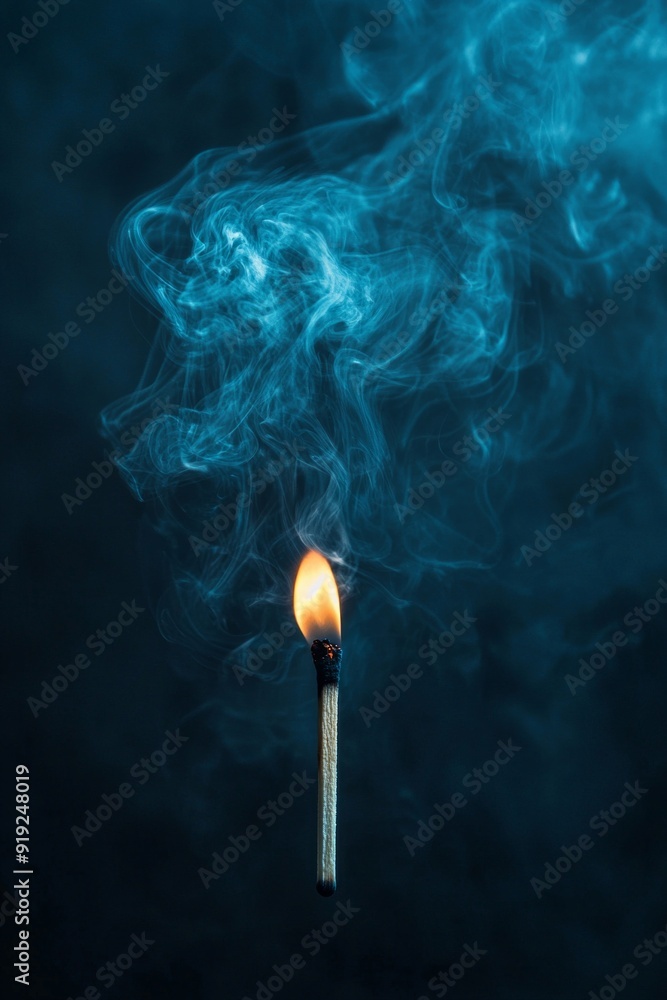 A lit matchstick in a dark room with smoke curling upwards. A lit matchstick in a dark room with smoke curling upwards.