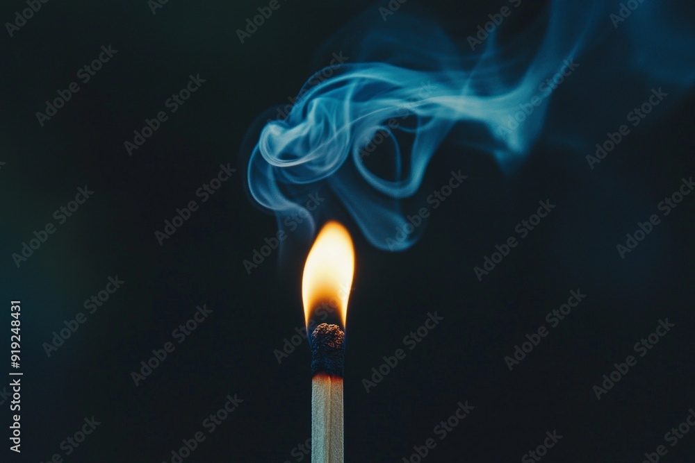 A lit matchstick in a dark room with smoke curling upwards. A lit matchstick in a dark room with smoke curling upwards.