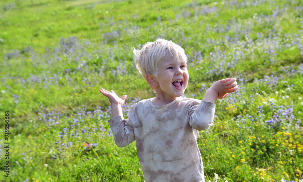 Outdoor portrait of expressive little boy with blond hair Outdoor portrait of expressive little boy with blond hair