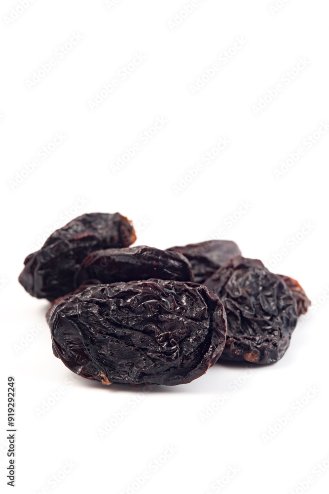 Dried prunes on a white background. Dried fruits. Dried prunes on a white background. Dried fruits.
