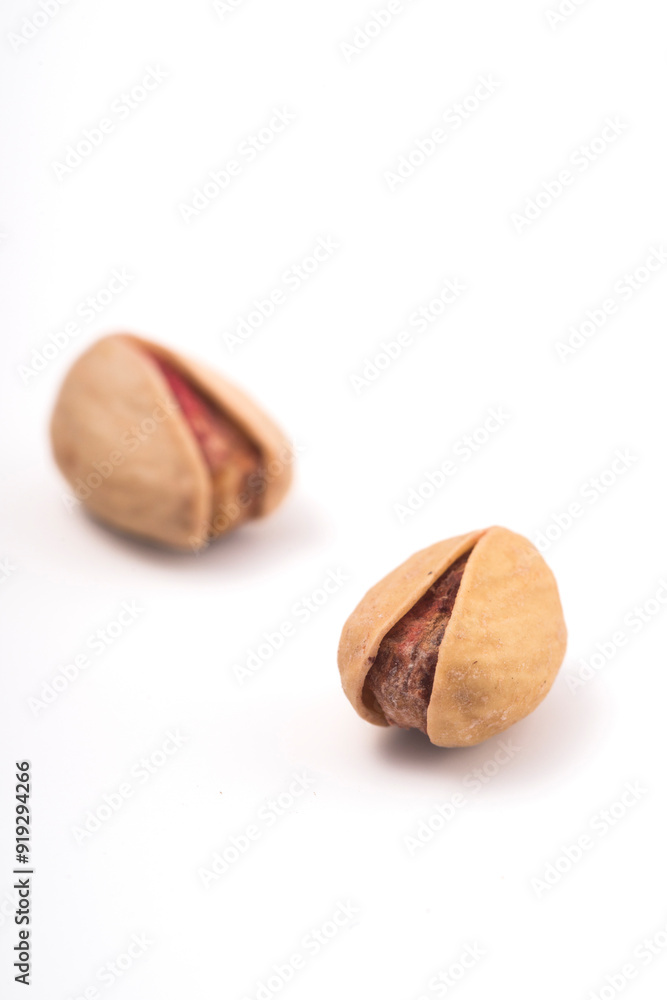 Pistachios nuts over white background. Healthy food concept. Pistachios nuts over white background. Healthy food concept.