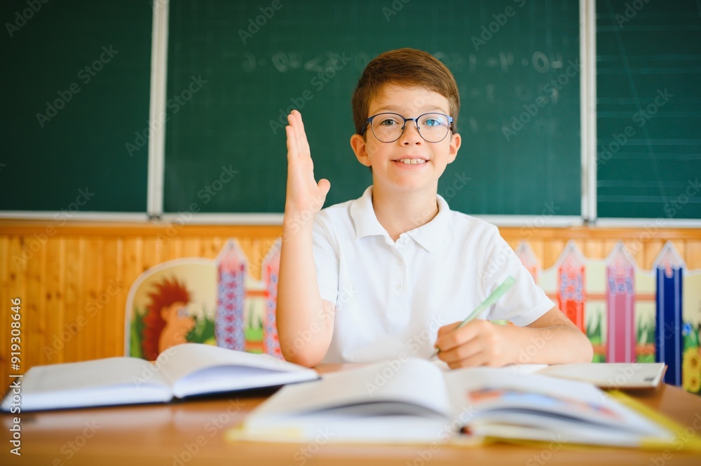 Portrait of little boy studying in classroom at school Portrait of little boy studying in classroom at school