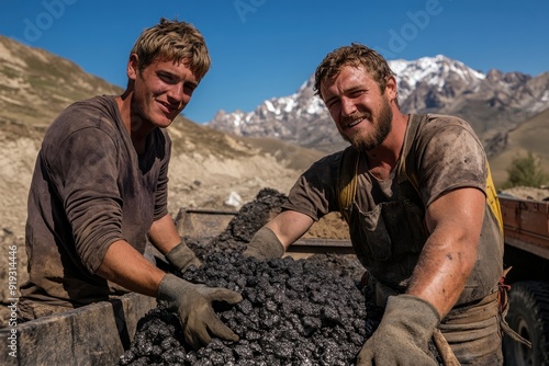 Two coal miners cheerfully working in a harsh mountain environment, their clothes and faces covered in coal dust, showing their strength and the challenging nature of their job.