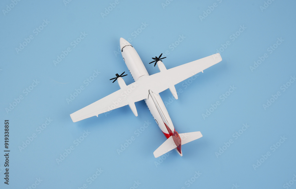 Airplane model on blue background. Copy space for text. Airplane model on blue background. Copy space for text.