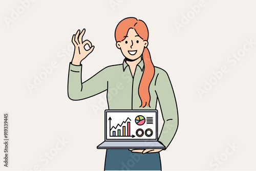 Business woman shows laptop with diagrams and ok gesture, reporting success of startup and income growth. Statistical data in computer of girl investor recommending using crm for business