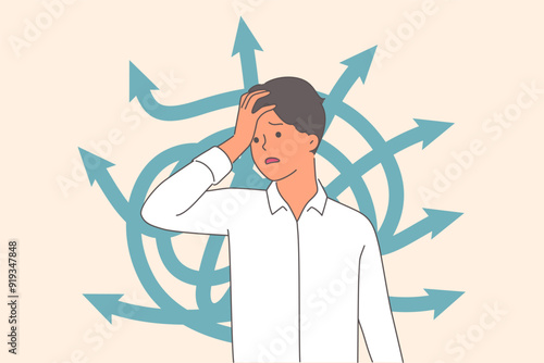 Business man is confused and suffers from confusing thoughts due to difficulty of choosing strategy
