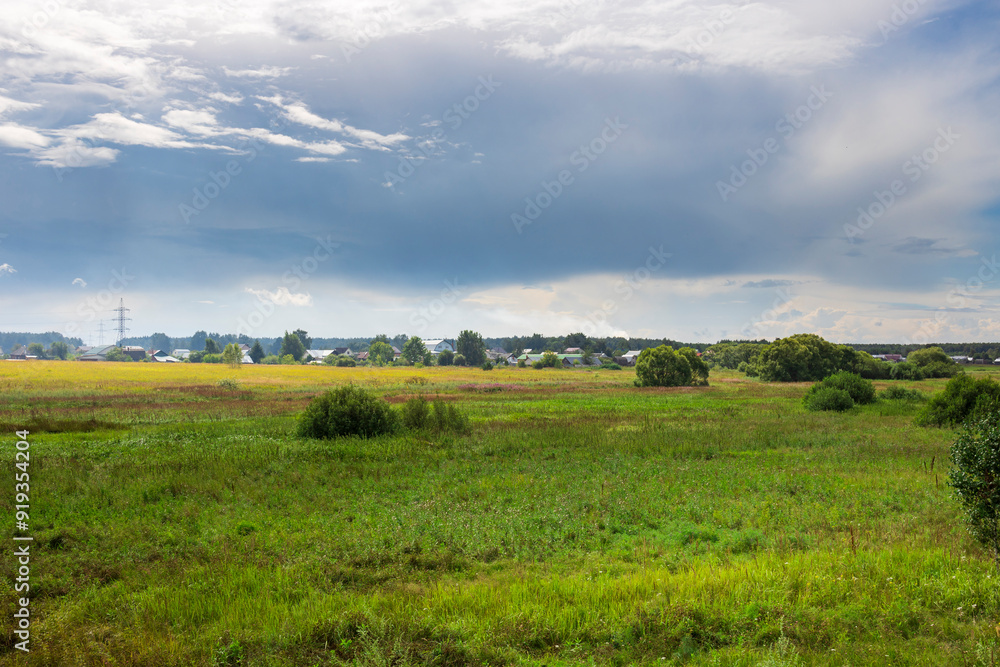 A vibrant expanse of green fields stretches under a dynamic sky, where sunlight dances on the landscape, infusing the countryside with life and tranquility. A vibrant expanse of green fields stretches under a dynamic sky, where sunlight dances on the landscape, infusing the countryside with life and tranquility.