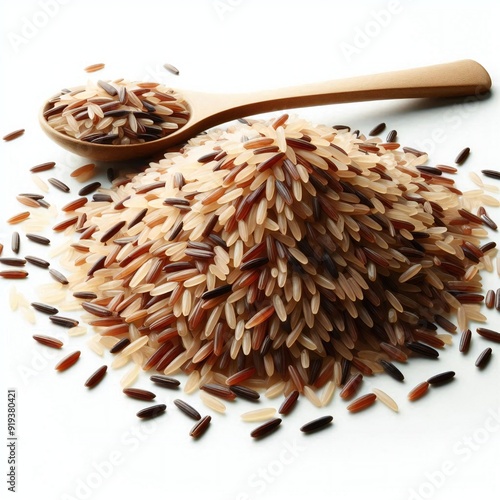 A pile of rice and a spoon with a wooden spoon. photo