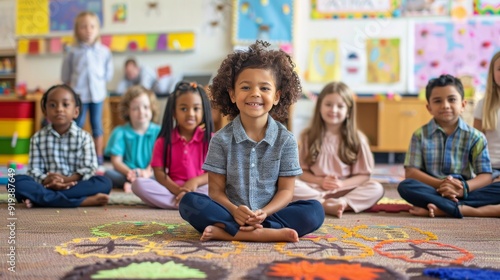 Kindergartners sitting happily on carpet in classroom