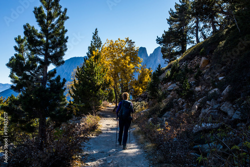 Young hiker woman in autumn in Aiguestortes and Sant Maurici National Park, Spain photo