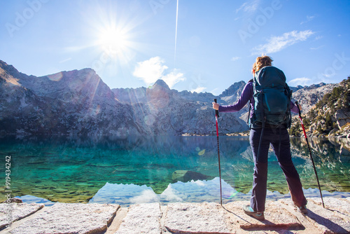 Young hiker woman in autumn in Aiguestortes and Sant Maurici National Park, Spain photo