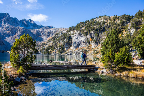 Young hiker woman in autumn in Aiguestortes and Sant Maurici National Park, Spain photo