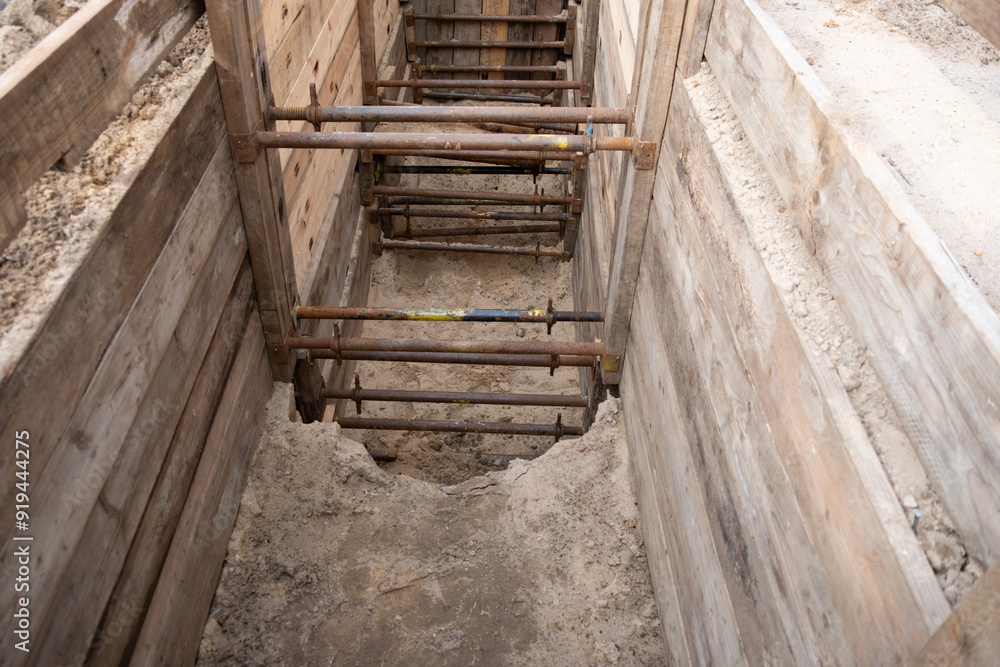 repairing underground utilities, essential infrastructure, protecting electrical wires in trench, repairing urban communications, conducting electrical networks repairing underground utilities, essential infrastructure, protecting electrical wires in trench, repairing urban communications, conducting electrical networks