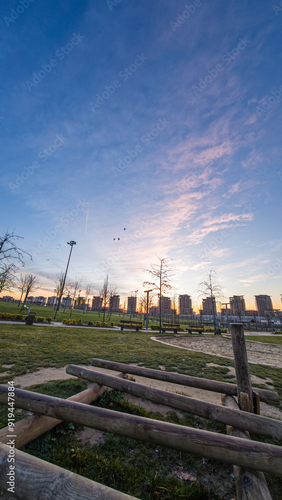 green lawn with city skyline vertical image green lawn with city skyline vertical image