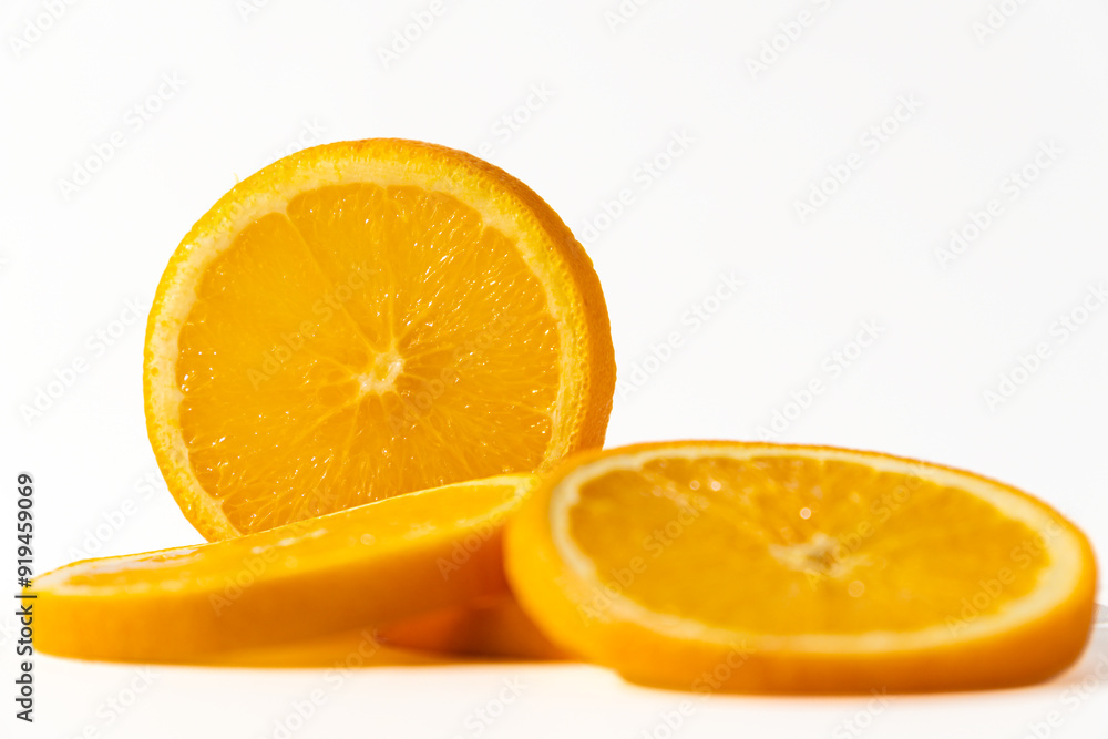 A pile of fresh orange slices, isolated on white background A pile of fresh orange slices, isolated on white background