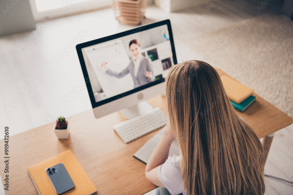 Photo of shiny cute girl dressed purple t-shirt writing diary remote education modern gadget indoors house apartment room Photo of shiny cute girl dressed purple t-shirt writing diary remote education modern gadget indoors house apartment room