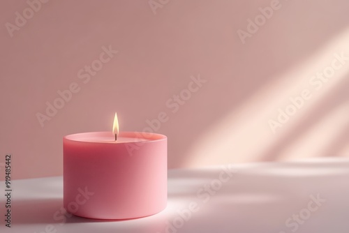 Wallpaper Mural Serene pink candle casting a soft glow in minimalistic setting with gentle light and shadow play, perfect for calming and relaxing ambiance. Torontodigital.ca