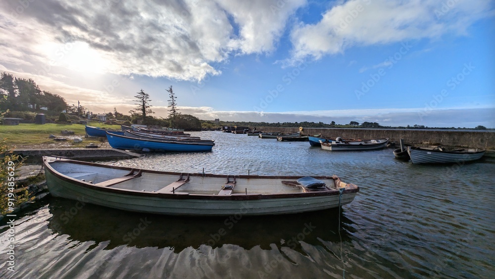 Old wooden fishing boats in Corrib lake at Annaghdown pier, county Galway, Ireland, nature background