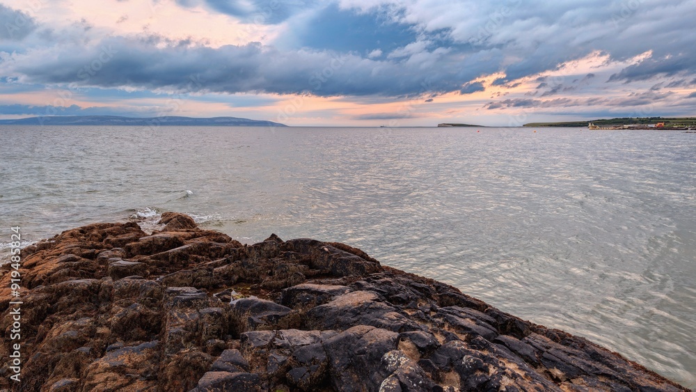 Dramatic cloudy coastal seascape sunset scenery, wild Atlantic way at Salthill beach, Galway, Ireland, nature background
