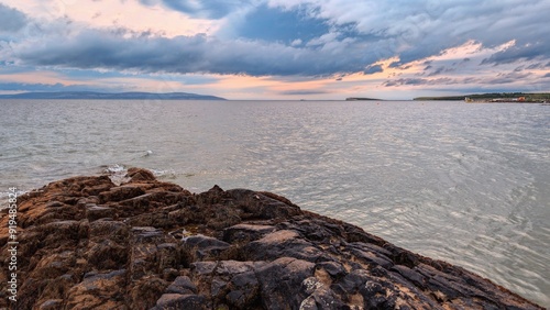Obraz na płótnie Dramatic cloudy coastal seascape sunset scenery, wild Atlantic way at Salthill beach, Galway, Ireland, nature background w salonie