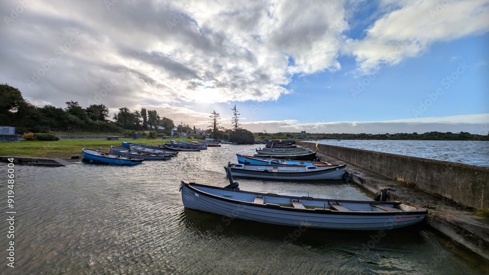 Old wooden fishing boats in Corrib lake at Annaghdown pier, county Galway, Ireland, nature background